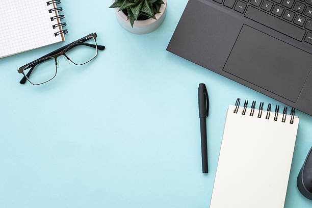 istock Office table desk with laptop, notepad and pen. 2215414788