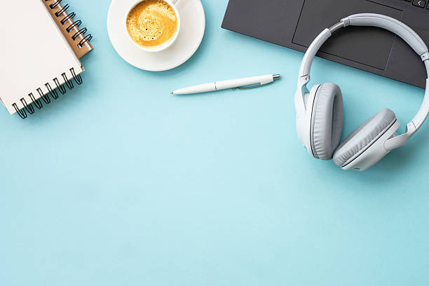 istock Office table desk with laptop, notepad, pen and cup of coffee. 2215414806