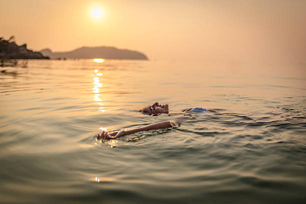 istock Relaxed Woman Floating in Thai Waters 2215421006