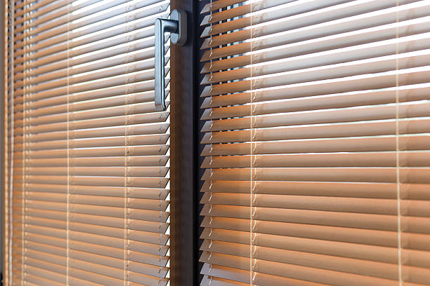 istock Aluminum window with wooden blinds and handle 2215421675