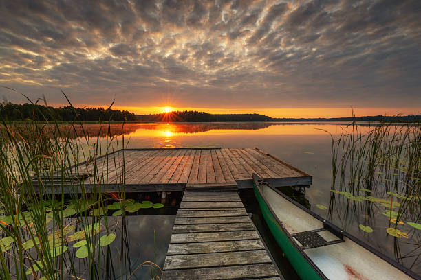 istock Beautiful summer sunrise over lake 2215421686