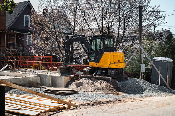 istock Bulldozer in front of building foundation. 2215422041