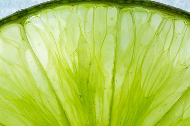 istock Macro lemon texture,Close-up macro of lemon texture,macro lemon texture,Macro close up surface texture Juicy slice of lime 2215422838
