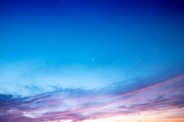 istock Vibrant sunset sky with a gradient of blue, purple, and pink clouds, featuring a single bright star, perfect for nature and tranquility themes. 2215423284