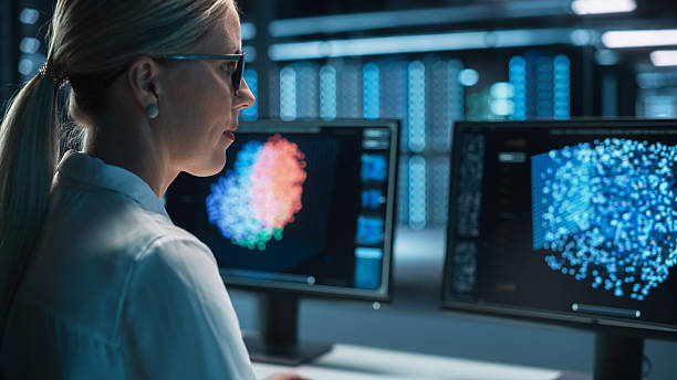 istock Portrait of Female Technical Operator Works with Display Showing Neural Network In the System Control Dark Room. Caucasian IT Technician Works on Artificial Intelligence. Big Data Scientific Research. 2215424854