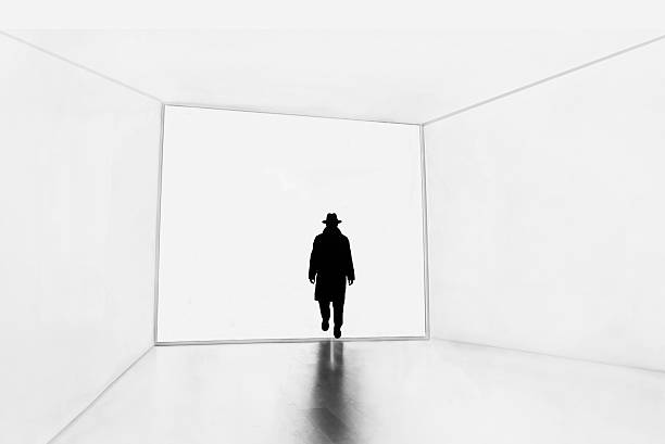 USA Chicago, mystery man walking in white space room.