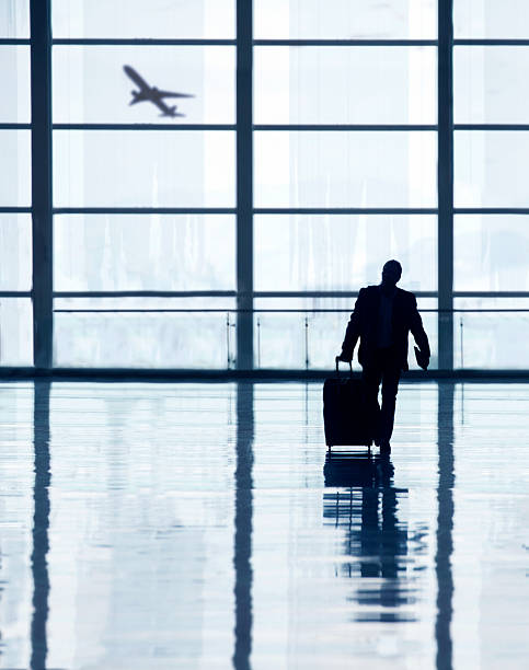 Man with Bags walking inside airport