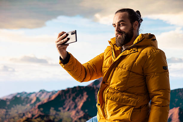 istock Determined adventurer enjoys the panoramic mountain landscape 2215427984