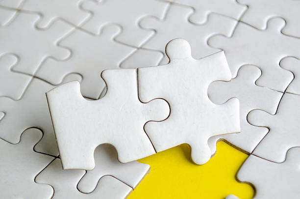 A white puzzle frame encircling a yellow center, presenting a clean and elegant design. Perfect for backgrounds, creative projects, or minimalistic compositions. 3D rendered image.