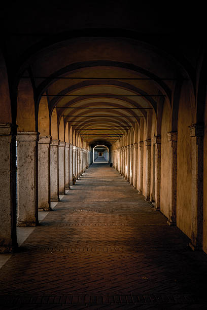 istock Dark tunnel perspective. Grunge architecture, old corridor in shadow. 2215429450