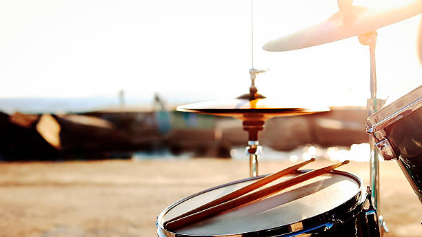 istock Drum kit  by  the sea at sunset 2215432948