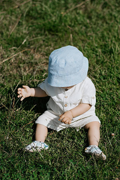 istock Mother and baby spending time together in nature, vertical frame, top view 2215433088