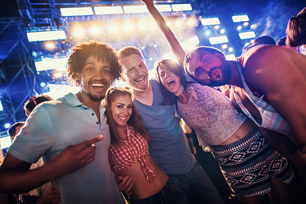 istock Friends dancing at a concert. 2215435121