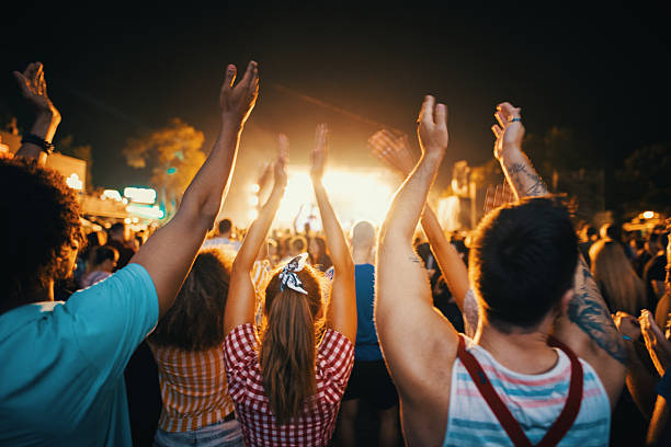 istock Friends dancing at a concert. 2215435127