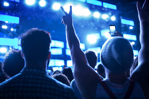 istock Friends dancing at a concert. 2215435133