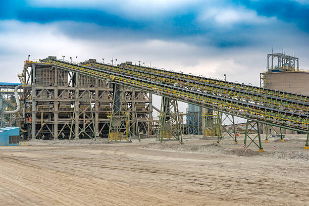 istock Extensive conveyor belts steadily transport copper mineral towards the crushing facility within a processing plant at a mine located in Chile. 2215437498