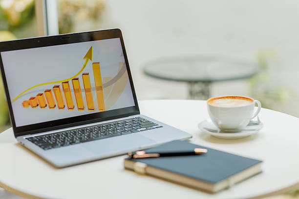 istock Two professionals discussing business growth and digital marketing strategy using graphs and laptops  ideal for content on e-commerce, finance, and data-driven planning 2215440785