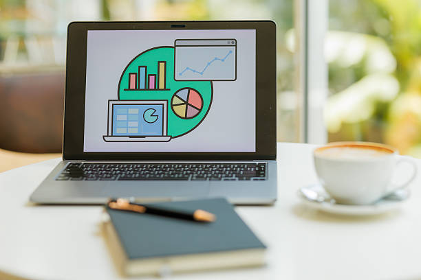 wo professionals discussing financial data and strategy with charts and laptops in a modern office  ideal for content on finance, teamwork, and investment planning.