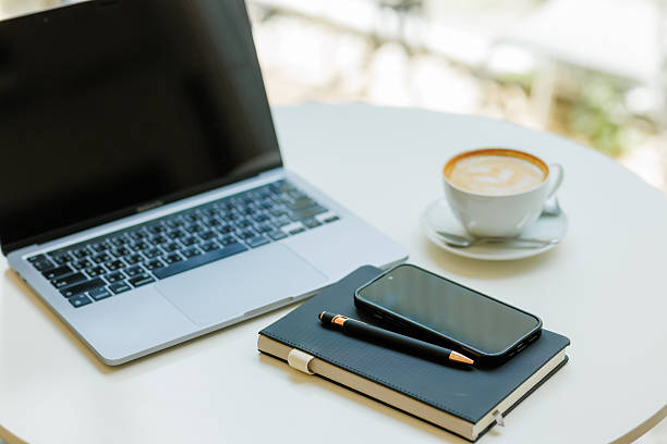 istock Modern minimalist desk setup with stationery, laptop, and documents  ideal for themes of productivity, planning, and creative business concepts. 2215440822