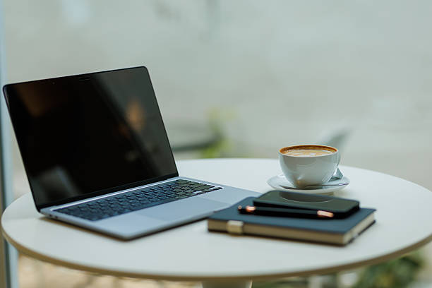 Modern minimalist desk setup with stationery, laptop, and documents  ideal for themes of productivity, planning, and creative business concepts.