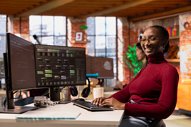 istock Portrait of upbeat programmer working in innovative startup office 2215440983