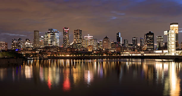 istock Montreal skyline at night with nice reflections in the St. Lawrence River 2215441190