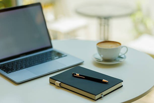 istock Minimalist workspace with coffee, laptop, and notebook  ideal for planning, remote work, and creative focus 2215441529