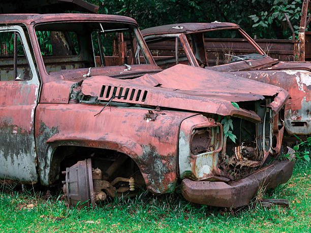 istock old car is sitting in a grassy field 2215442806
