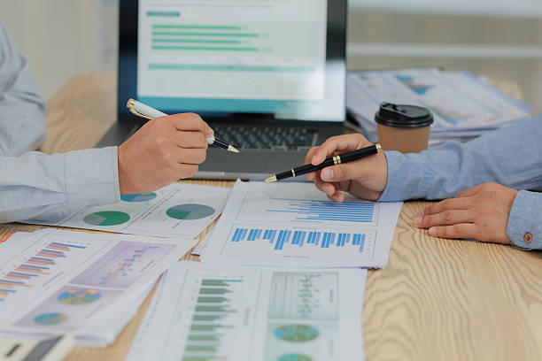 istock Corporate meeting held to summarize and analyze annual income and expenses, highlighting financial performance and strategic planning. 2215444148