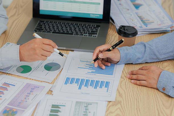 istock Corporate meeting held to summarize and analyze annual income and expenses, highlighting financial performance and strategic planning. 2215444191