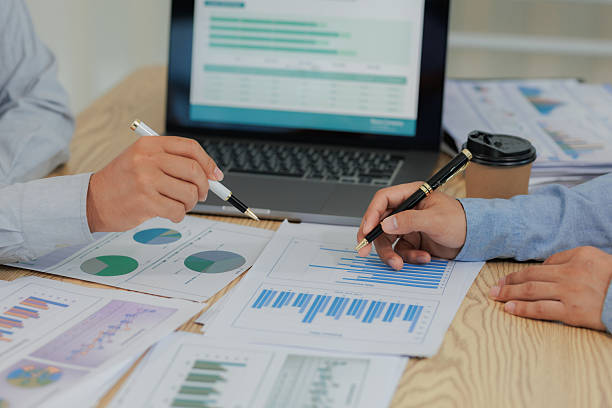 istock Corporate meeting held to summarize and analyze annual income and expenses, highlighting financial performance and strategic planning. 2215444193