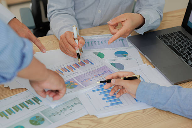 istock Corporate meeting held to summarize and analyze annual income and expenses, highlighting financial performance and strategic planning. 2215444246