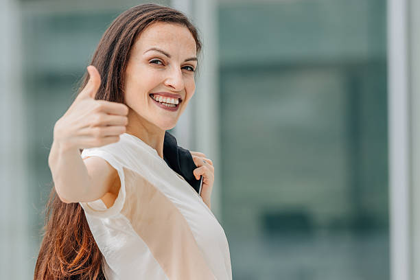 istock business woman with okay gesture 2215445521