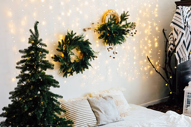 istock Cozy winter setting with decorated wall and Christmas tree lights 2215446681