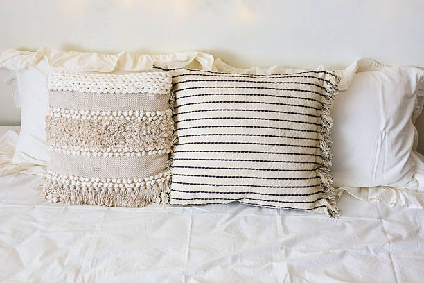 istock Decorative pillows on a cozy bed enhance interior design with texture and comfort 2215446707