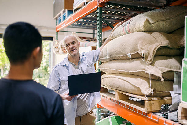istock Coffee Roaster Discusses Bean Sourcing And Origin With Client 2215447687