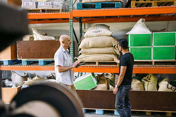 istock Coffee Roaster Discusses Bean Sourcing And Origin With Client 2215447735