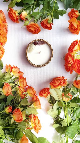 istock Romantic Flat Lay with Orange Roses and Scented Candle 2215448256