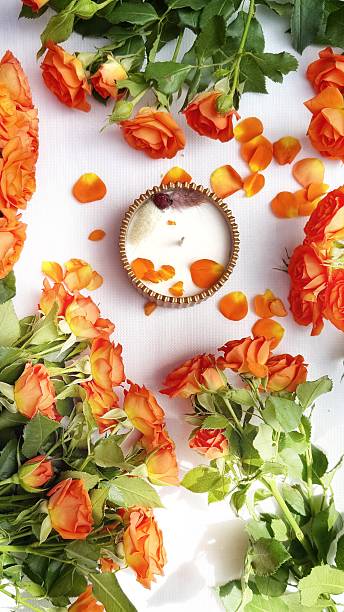 istock Romantic Flat Lay with Orange Roses and Scented Candle 2215448262