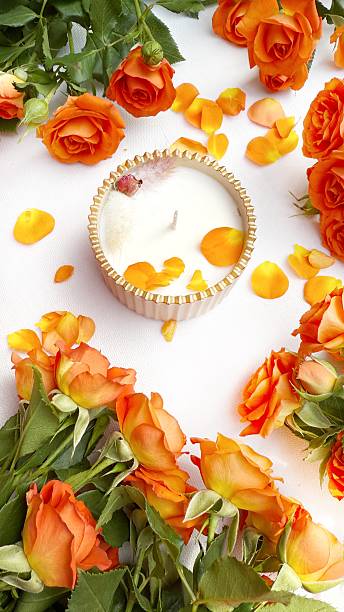 istock Romantic Flat Lay with Orange Roses and Scented Candle 2215448280