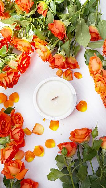 istock Romantic Flat Lay with Orange Roses and Scented Candle 2215448321