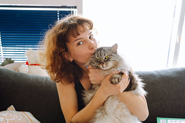 istock young woman spending time with her cat 2215450251