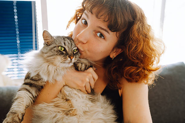 istock young woman spending time with her cat 2215450787