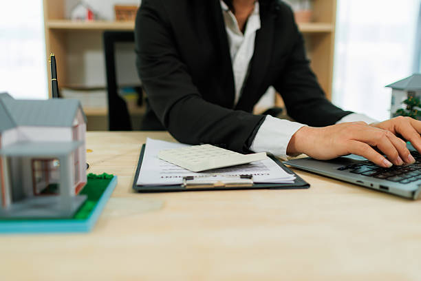 istock An insurance agent in the process of pitching a policy. 2215451849