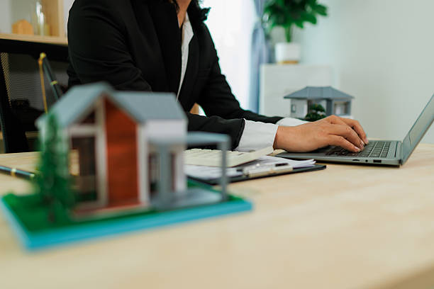 istock An insurance agent in the process of pitching a policy. 2215451859