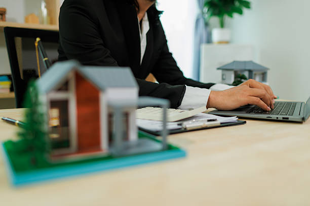 istock An insurance agent in the process of pitching a policy. 2215451867