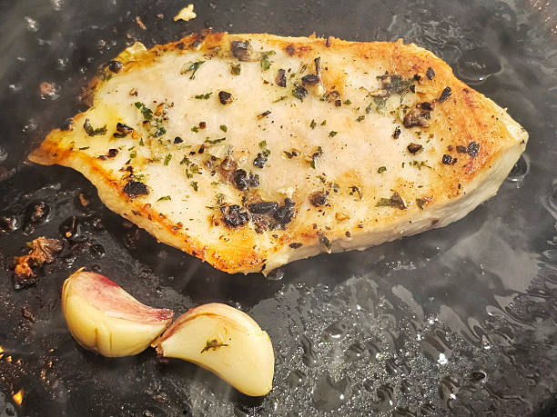 Two cloves of garlic in the frying pan