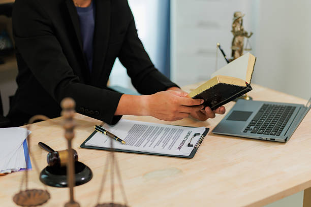 istock Signing in acknowledgment and conducting legal representation correctly. 2215452295