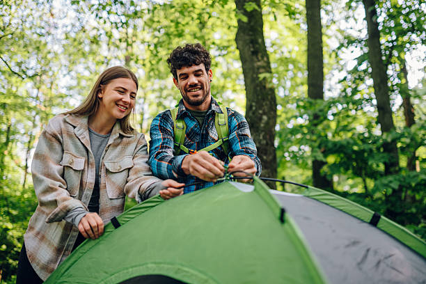 istock Young couple enjoying camping adventure together 2215455804