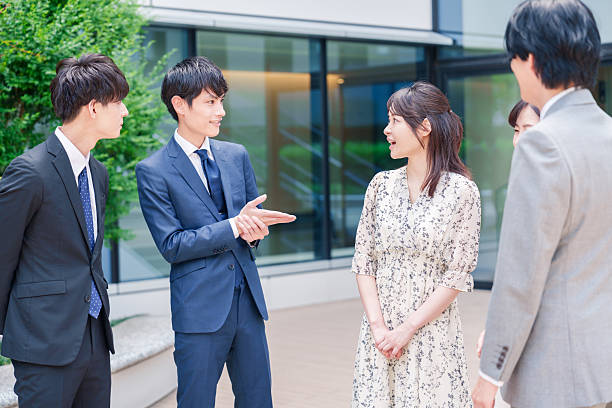 istock Business people chatting outdoors 2215461856